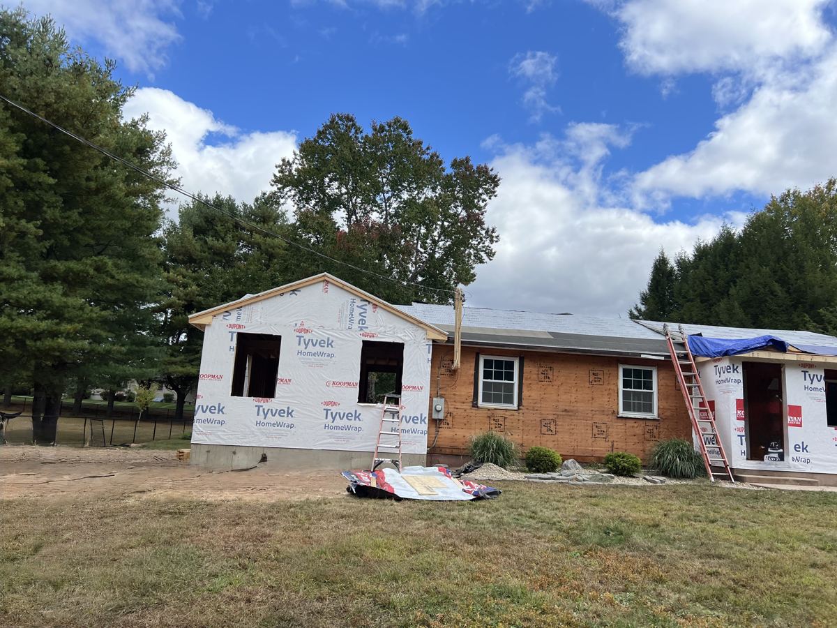 Rear addition wrapped in Tyvek off a ranch home