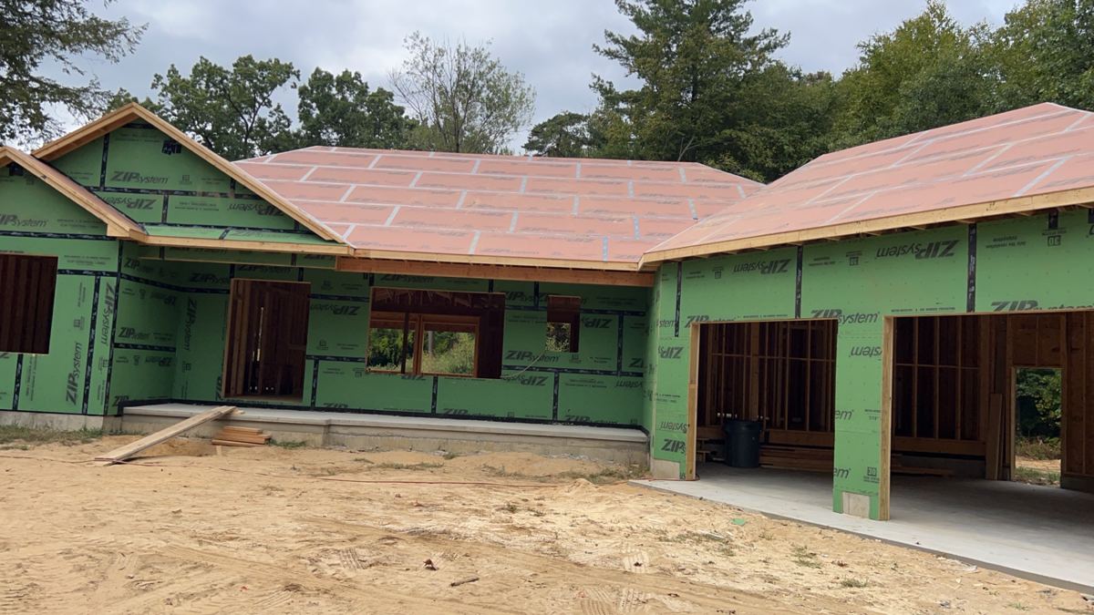 Ranch garage wing sheathed in ZIP